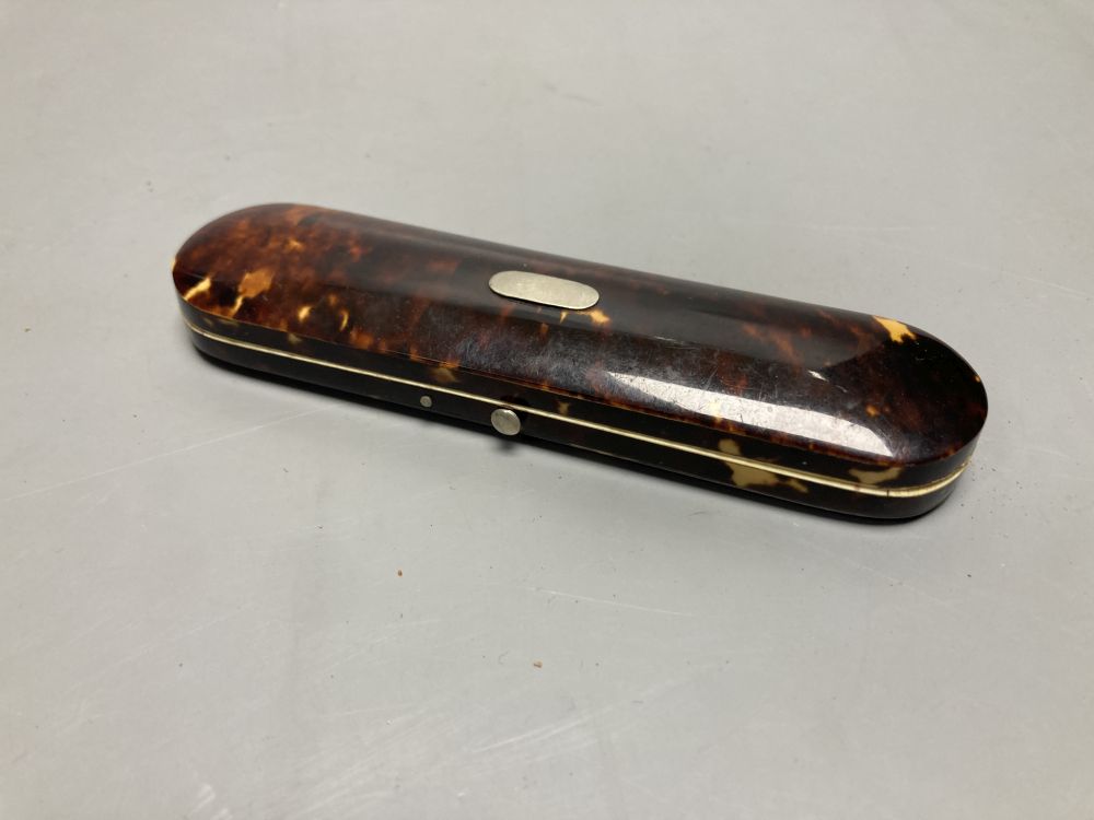 A 19th century papier mache faux tortoiseshell snuff box and a tortoiseshell case containing lace bobbin and needles